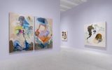 A gallery with light purple walls displays abstract paintings featuring organic shapes and muted colors. Three large canvases hang on adjacent walls, with subtle lighting and a polished floor reflecting the artwork.