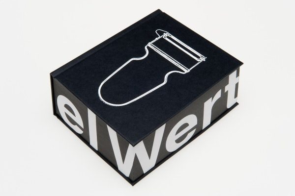 A black box with white font on the sides reading 