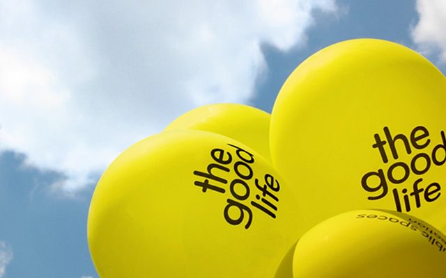 Yellow balloons with black text reading 