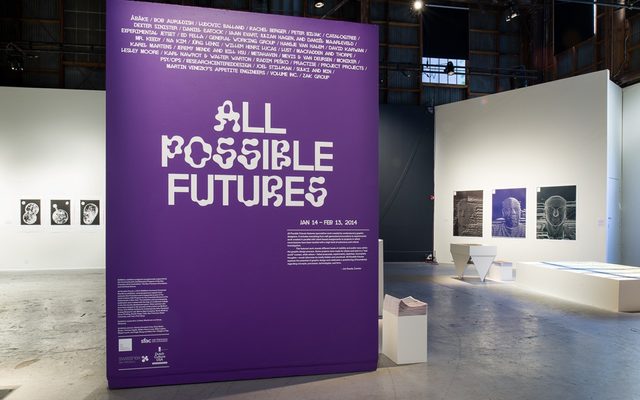 A purple wall-sized display reading 