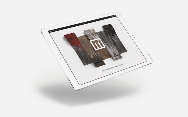 A white electronic tablet levitating above a white suface, displaying a LOGO: 2018 NeoCon Showroom Guide