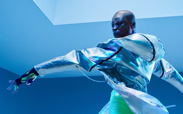 An adult poses wearing Nike sportswear