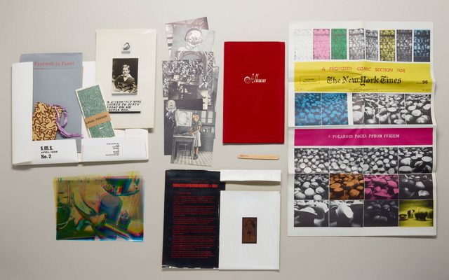 Display of historical playbills, pictures, a popsicle stick, and page from the New York Times