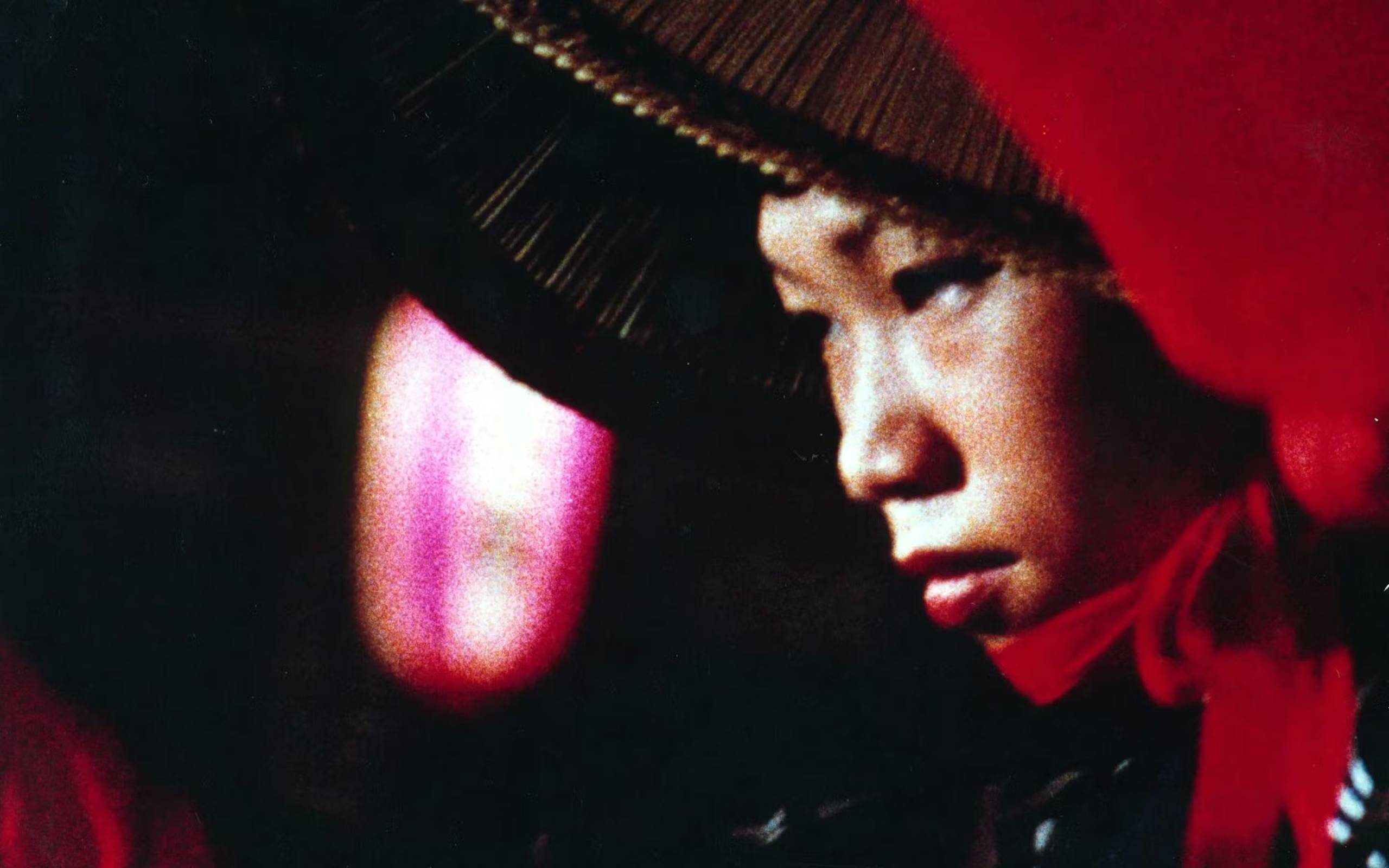 A close up still of a person in traditional Asian garments